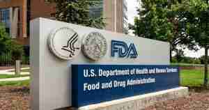 Outdoor sign for the U.S. Department of Health and Human Services and the FDA, with agency logos and the words 'Food and Drug Administration'.